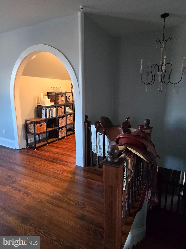 374 Finley Rd, Raphine, VA 24472 - dining space featuring arched walkways, wood finished floors, a chandelier, and baseboards