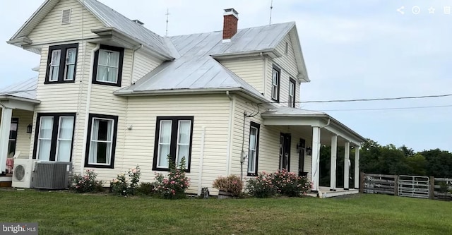 374 Finley Rd, Raphine, VA 24472 - view of property exterior with fence, a lawn, a chimney, and metal roof