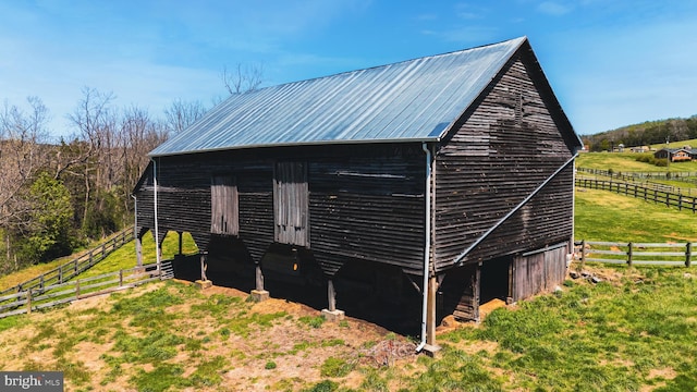 374 Finley Rd, Raphine, VA 24472 - view of home's exterior featuring metal roof, fence, a rural view, a pole building, and an outdoor structure