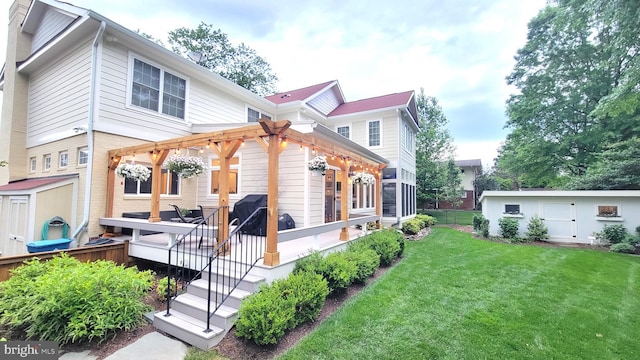 view of side of property with a deck, a yard, an outbuilding, and a pergola