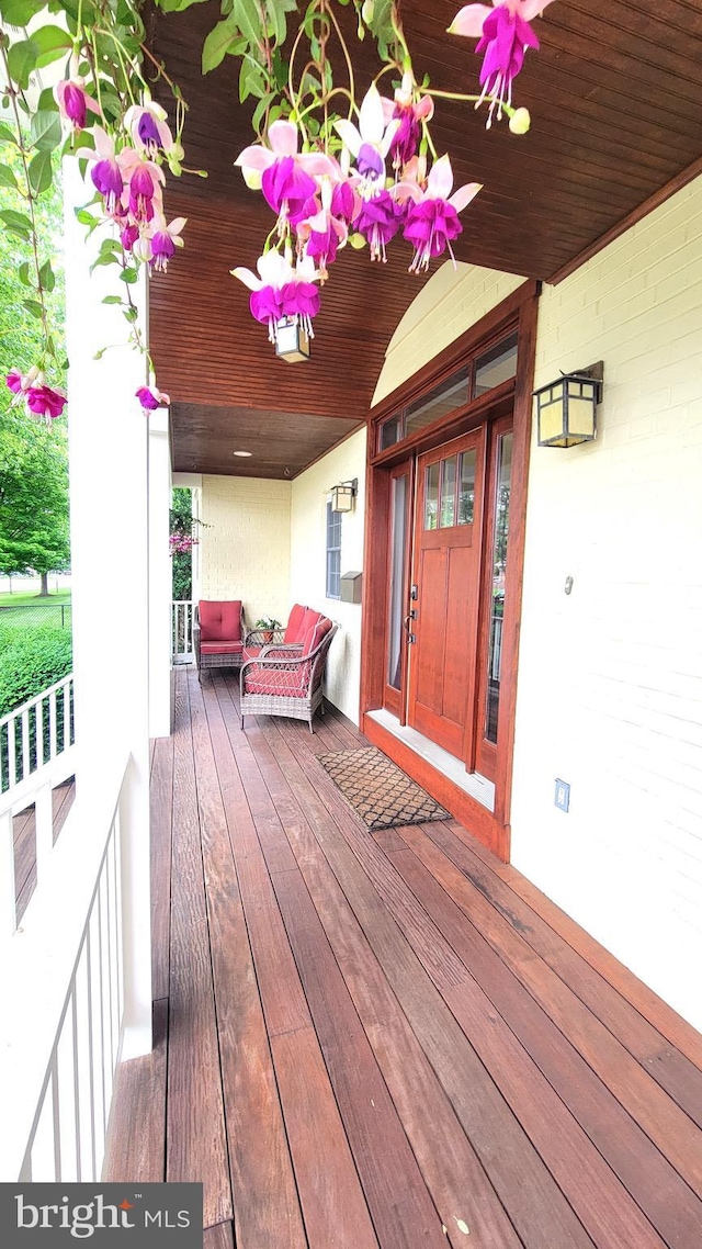 wooden deck featuring a porch