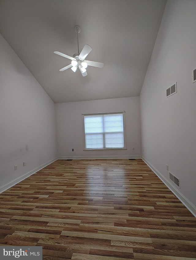 empty room featuring dark wood finished floors, visible vents, and a ceiling fan