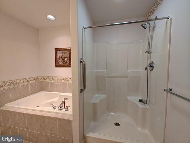 full bathroom with a shower and a garden tub