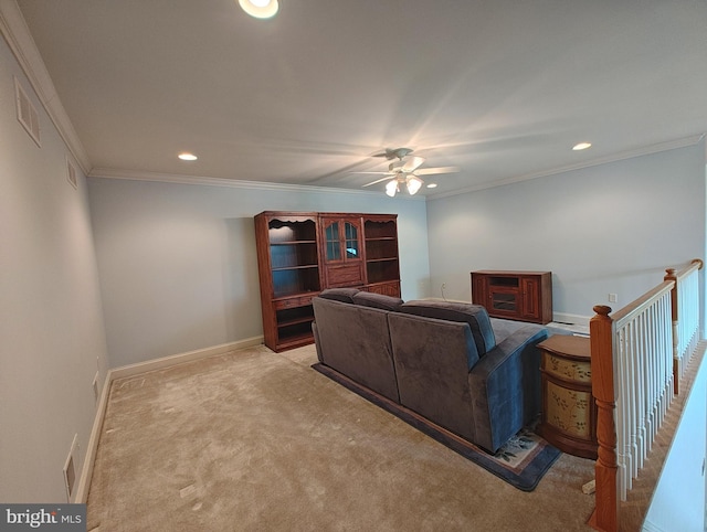 living room with ornamental molding, recessed lighting, light carpet, and baseboards