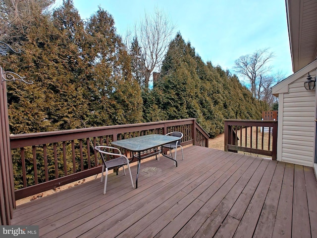 wooden deck with outdoor dining space