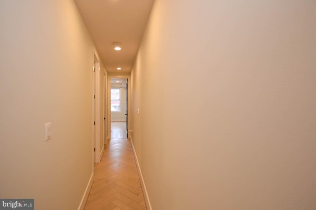 hall featuring baseboards