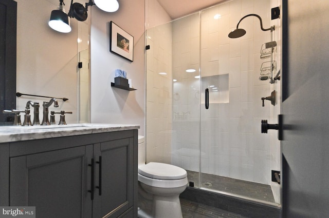 full bath with toilet, a shower stall, and vanity