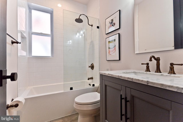 full bath featuring toilet, washtub / shower combination, and vanity