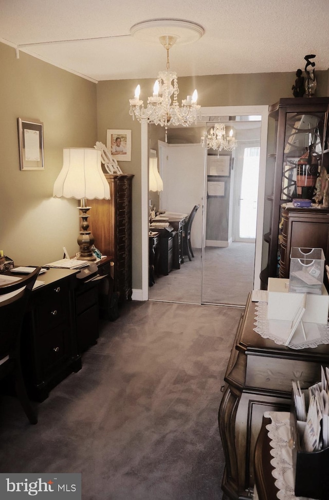 interior space featuring a chandelier and carpet