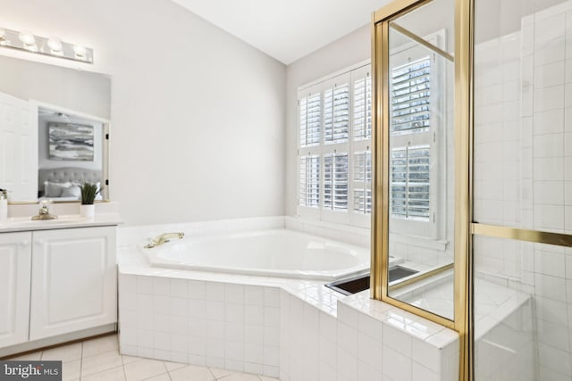 full bath featuring a stall shower, vanity, a bath, and tile patterned floors