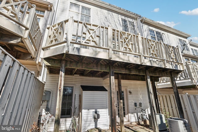 back of house featuring a balcony