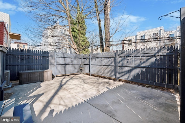 view of patio featuring central air condition unit and a fenced backyard