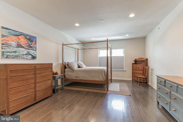 bedroom featuring dark wood-style floors, baseboards, and recessed lighting