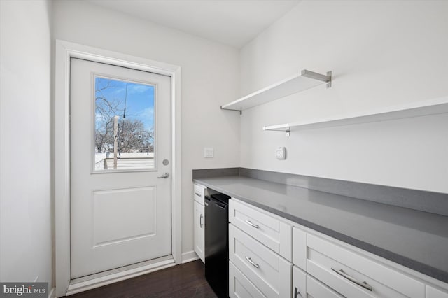 kitchen with dark countertops, white cabinetry, open shelves, and dark wood-style flooring