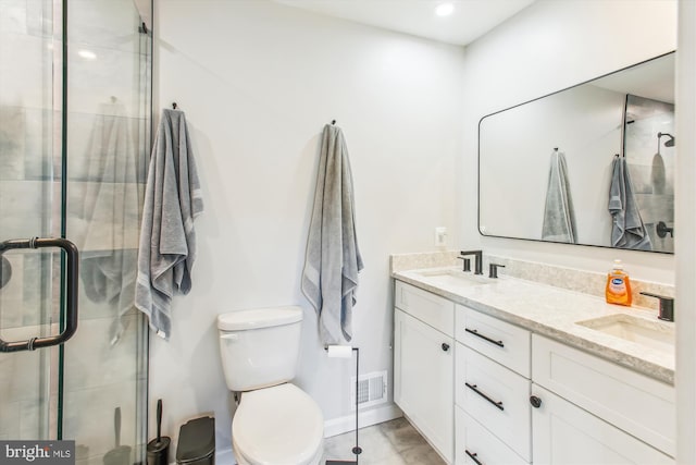 full bathroom featuring a shower stall, visible vents, and a sink