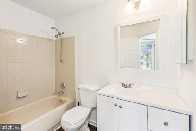 full bath featuring bathing tub / shower combination, vanity, and toilet