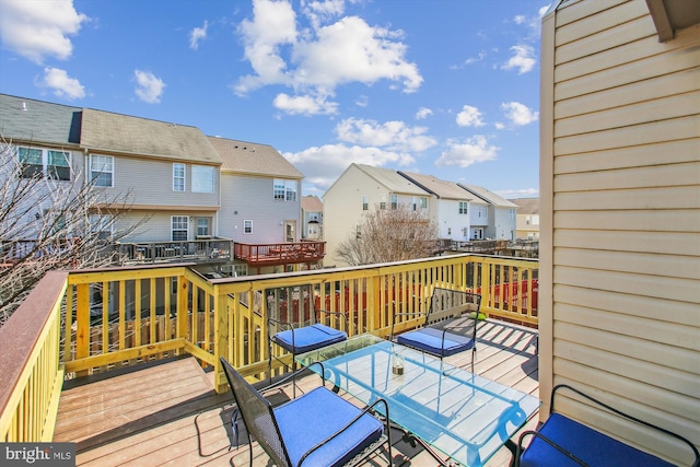 wooden deck with a residential view