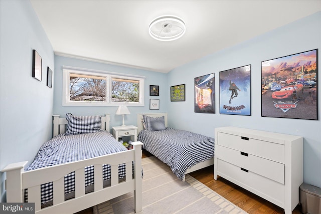 bedroom with wood finished floors