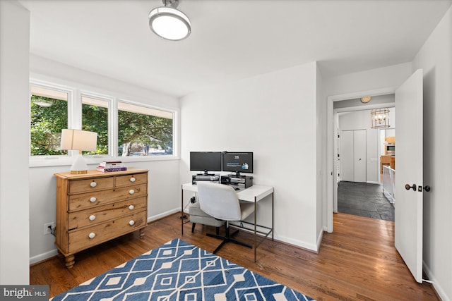 office area with baseboards and wood finished floors