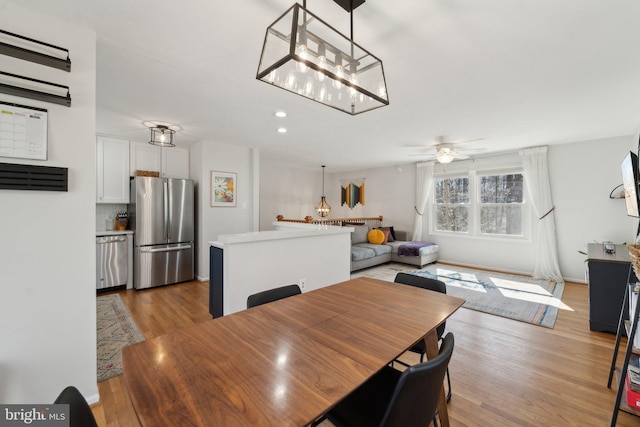 dining area featuring a ceiling fan, recessed lighting, and wood finished floors