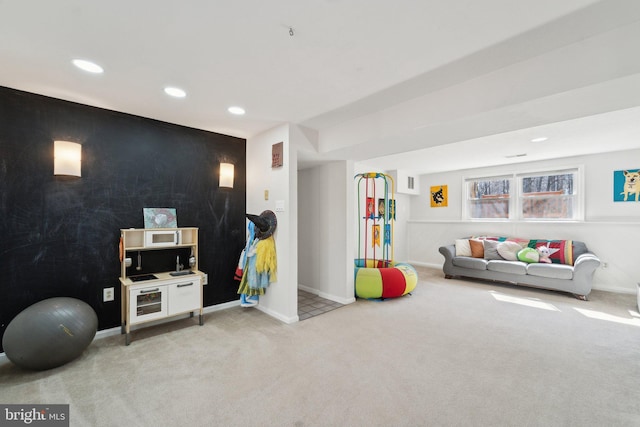 game room featuring light carpet, visible vents, baseboards, an accent wall, and recessed lighting