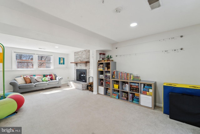 game room featuring visible vents, baseboards, carpet, a brick fireplace, and recessed lighting