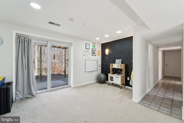 interior space featuring radiator, carpet floors, visible vents, and recessed lighting