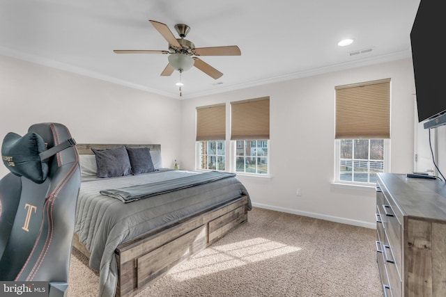 bedroom featuring baseboards, multiple windows, visible vents, and light colored carpet