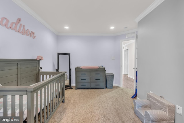 bedroom featuring light carpet, baseboards, and crown molding