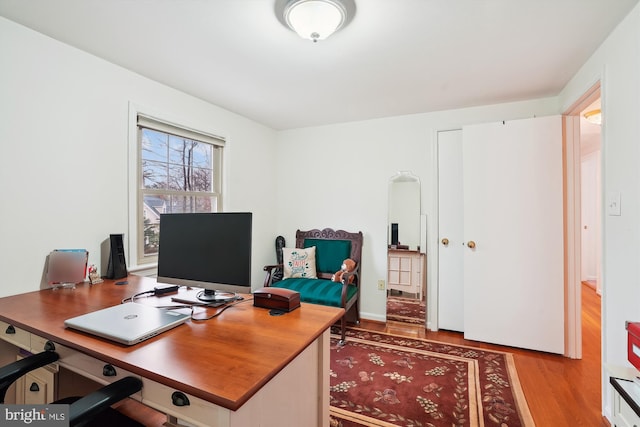 home office with wood finished floors