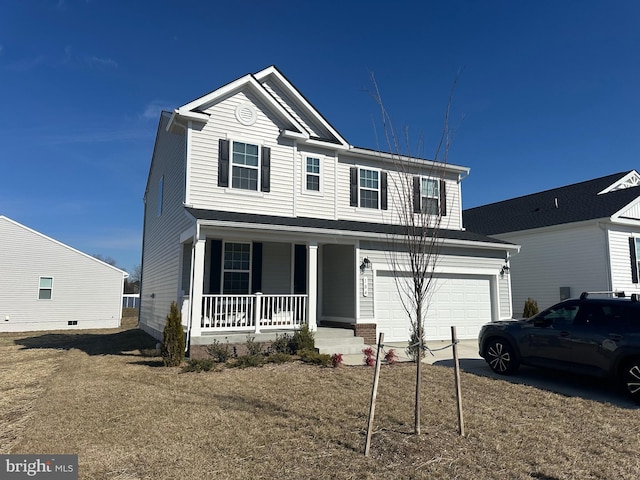 traditional home with covered porch, driveway, a front lawn, and an attached garage