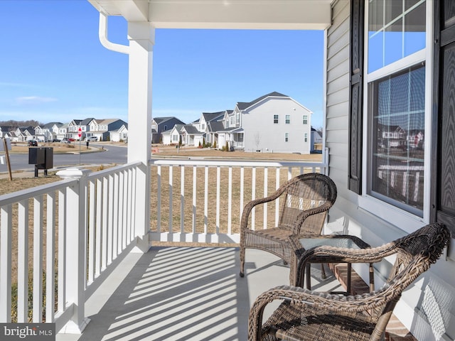 balcony featuring a residential view and a porch