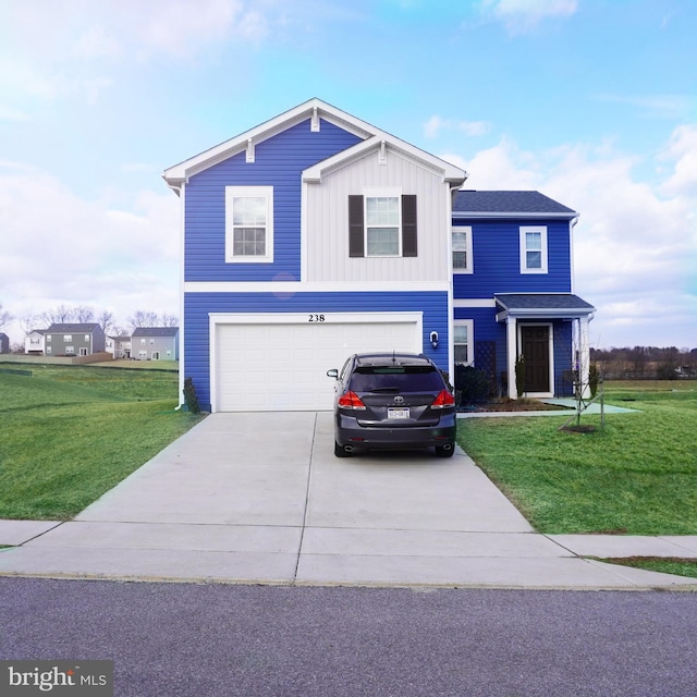 view of front of property with a garage, a front yard, driveway, and board and batten siding