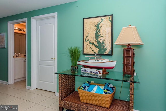 interior details with a sink and baseboards