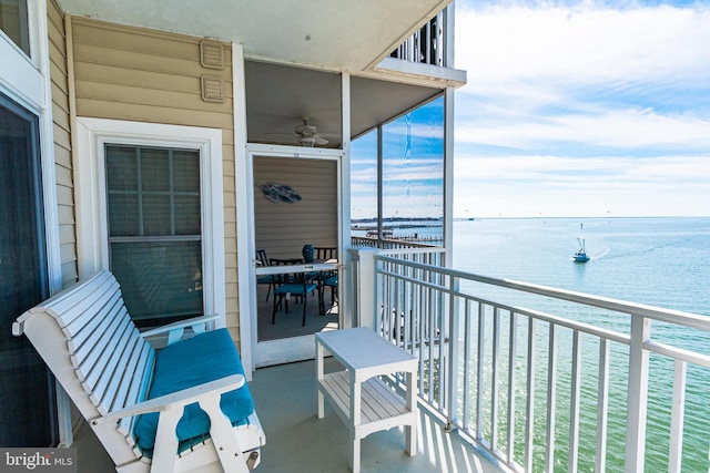 balcony featuring a water view