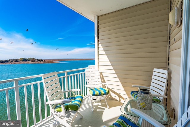 balcony featuring a water view