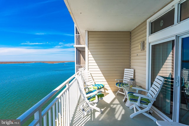 balcony featuring a water view