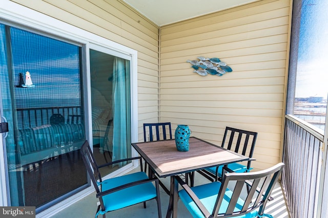 balcony with outdoor dining area