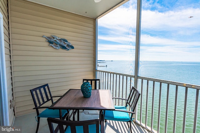 balcony featuring a water view