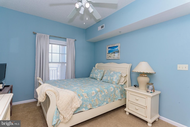 bedroom with carpet floors, baseboards, visible vents, and ceiling fan