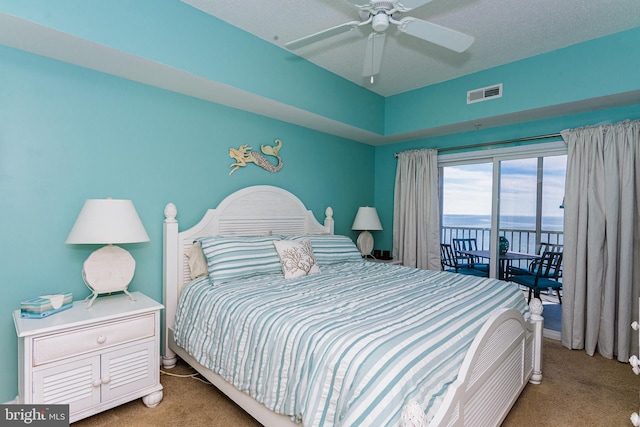 bedroom with access to exterior, ceiling fan, visible vents, and carpet flooring