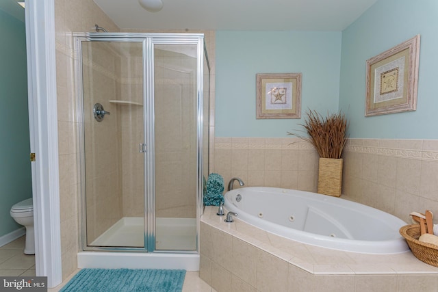 full bathroom with toilet, tile patterned flooring, a tub with jets, and a shower stall