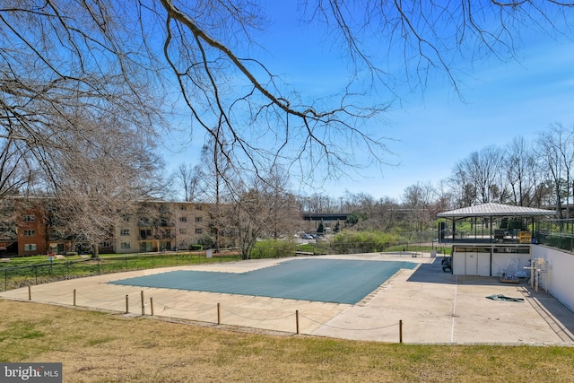 view of pool featuring a lawn, a patio, a fenced in pool, fence, and a gazebo