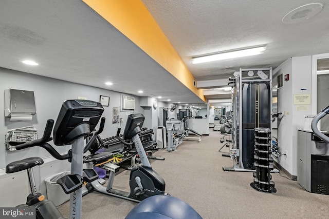 workout area with a textured ceiling