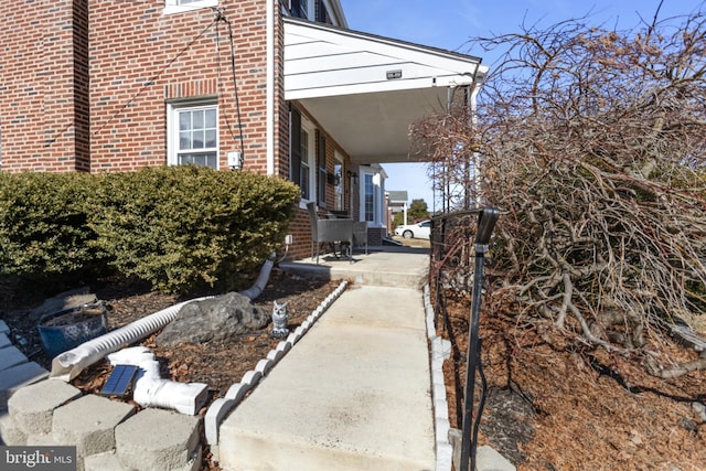 view of home's exterior with brick siding