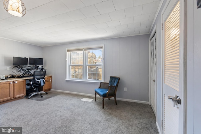 office area featuring baseboards and light colored carpet