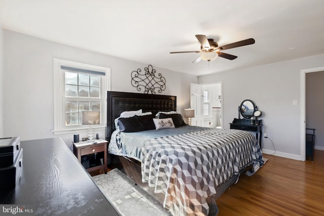 bedroom featuring ceiling fan, baseboards, and wood finished floors