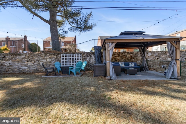 view of yard with fence, a gazebo, and a patio