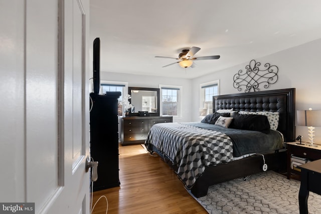 bedroom featuring ceiling fan and light wood-style flooring