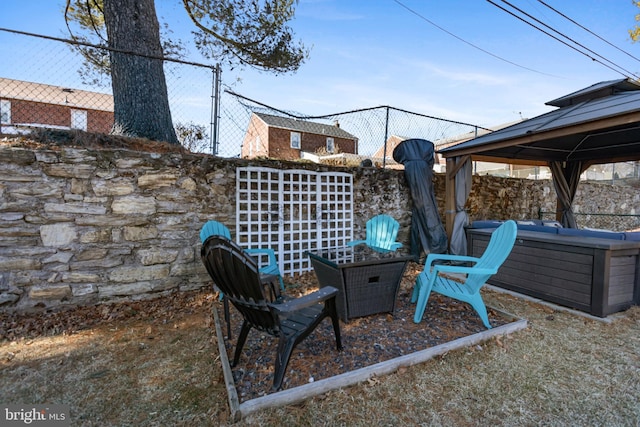 view of patio with fence and a gazebo